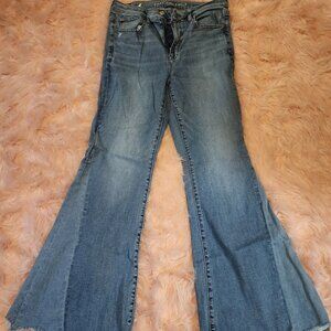 American Eagle NeXt Level Festival Flare Jean distressed raw hem